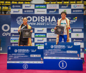 Women's Singles Winner Unnati Hooda (R) stands on the podium with the runner up Smit Toshniwal(Left) at Odisha Open 2022 in Cuttack on Sunday.