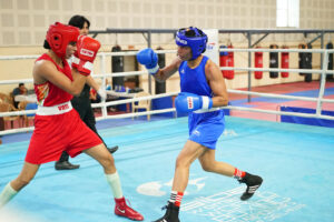 Nikhat (blue) in action enroute her 7-0 win against Manju Rani during the trials for Asian Games at Indira Gandhi stadium in Delhi on Monday.