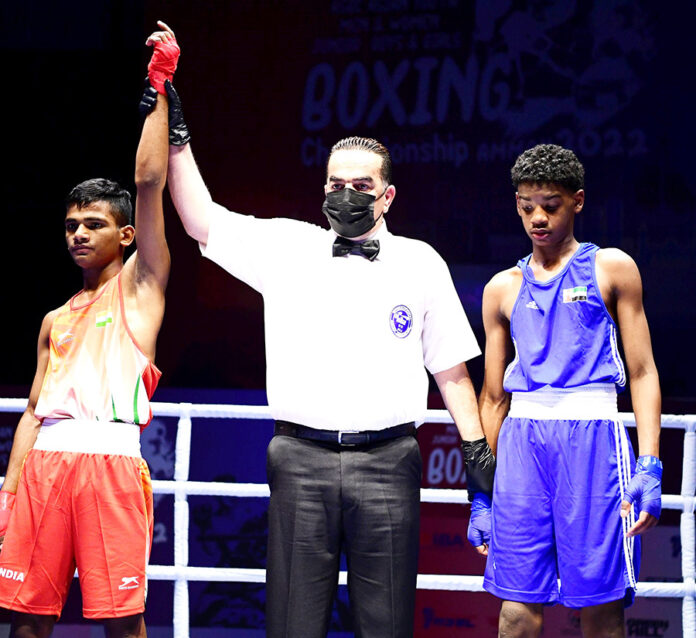 Ravi Saini (in Red) celebrates after winning his bout in the 48kg junior boys section at the 2022 ASBC Asian Youth & Junior Boxing Championship in Amman Jordan