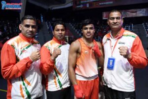 Vanshaj posese along with the coaches after winning the youth boys 63.5kg semi-finals at the 2022 ASBC Asian Youth & Junior Boxing Championships in Amman, Jordan on Friday, March 11, 2022