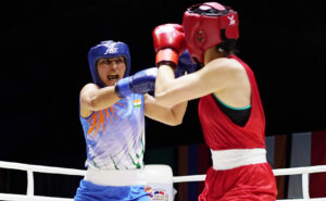 India's Pooja (in Blue) punches Thailand’s Baison Manikon during the women's 69kg semi-final at the Thailand Open International Boxing Tournament in Phuket on Friday, April 8, 2022