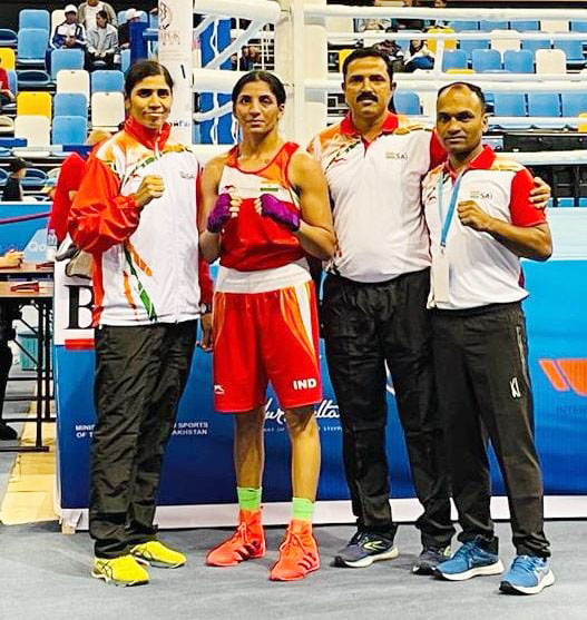 Simranjit Kaur poses with the coaches after her victory in the opening round of Elorda Cup in Kazakhstan on Wednesday, June 29, 2022 