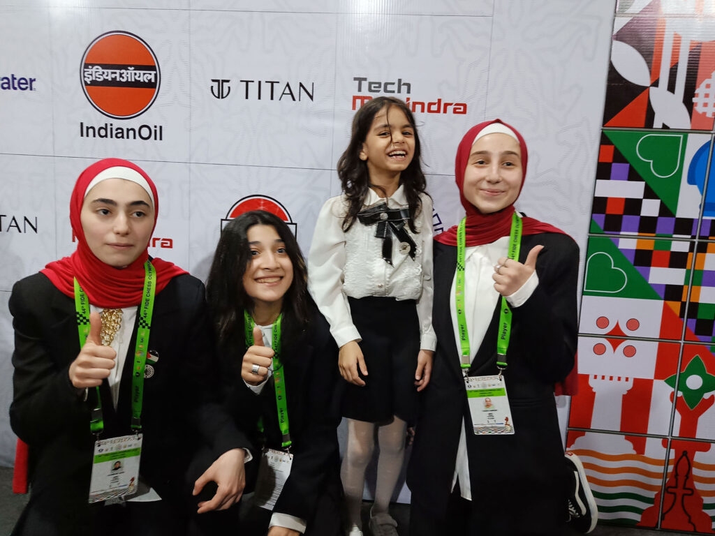 Youngest player at the 44th Chess Olympiad Randa Seder of Palestine with her teammates on Saturday