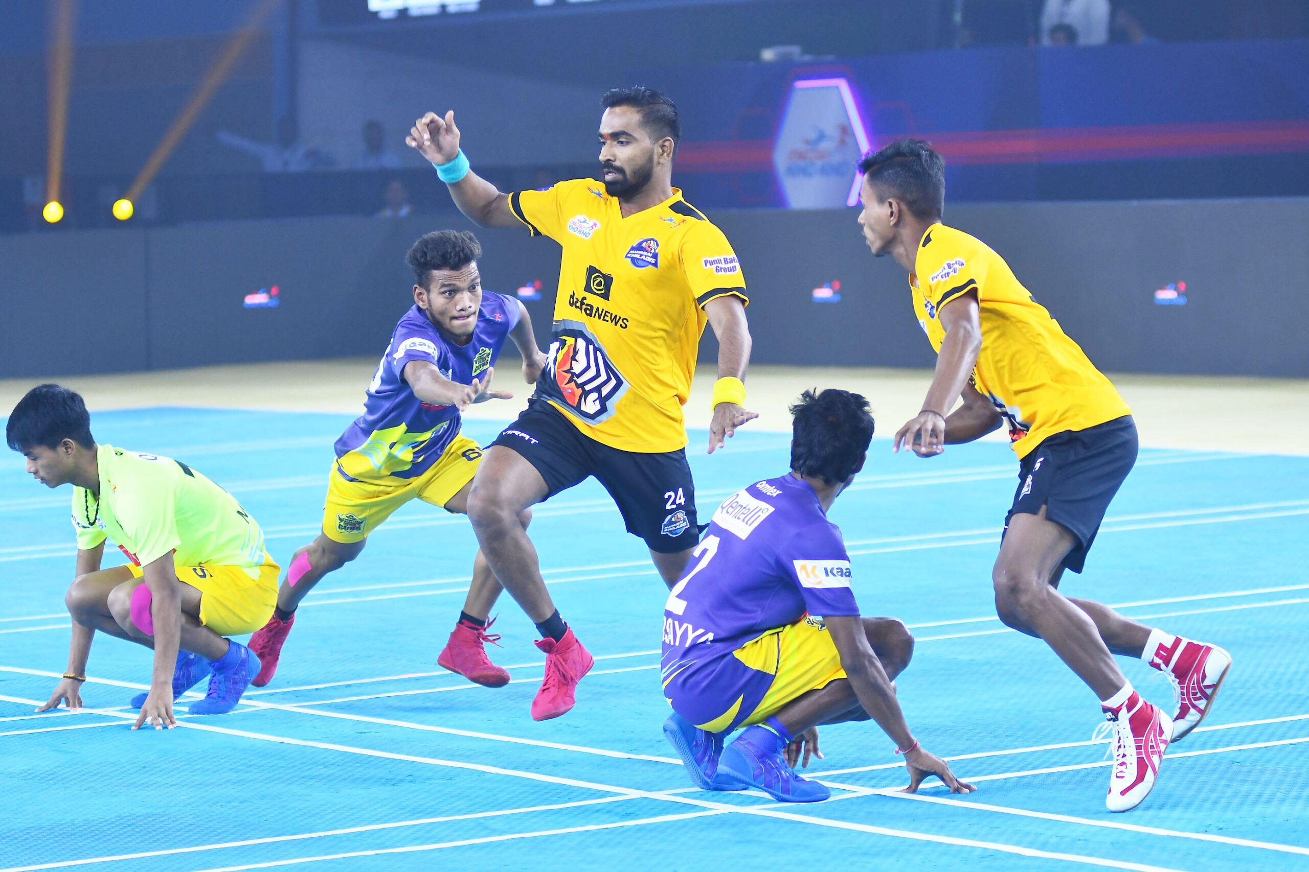 Ramji Kashyap of Chennai Quick Guns (in Blue) chases Mumbai Khiladis defenders during an Ultimate Kho Kho Season 1 match in Pune on Monday, August 29, 2022