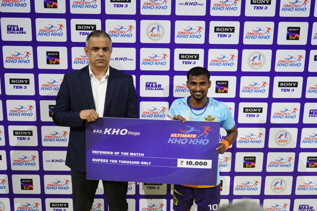 Vishal Sharma, COO & League Director, Ultimate Kho Kho gives Defender of the Match to Chennai Quick Guns captain Amit Patil after Ultimate Kho Kho match on Friday