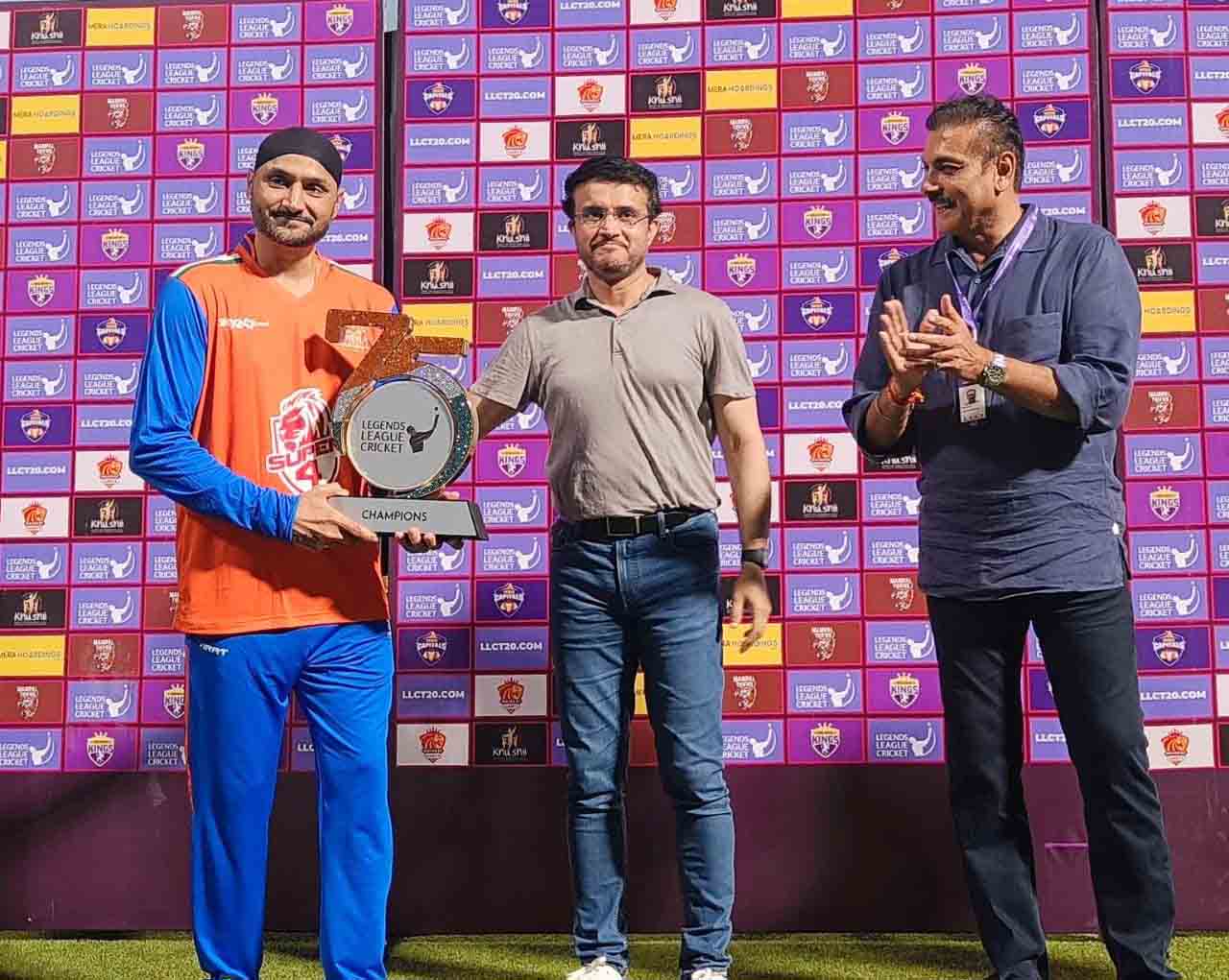 Sourav Ganguly hands over the trophy to India Maharajas Captain Harbhajan Singh as India Maharajas beat World Giants in one off benefit match at Eden Gardens, Kolkata on Friday