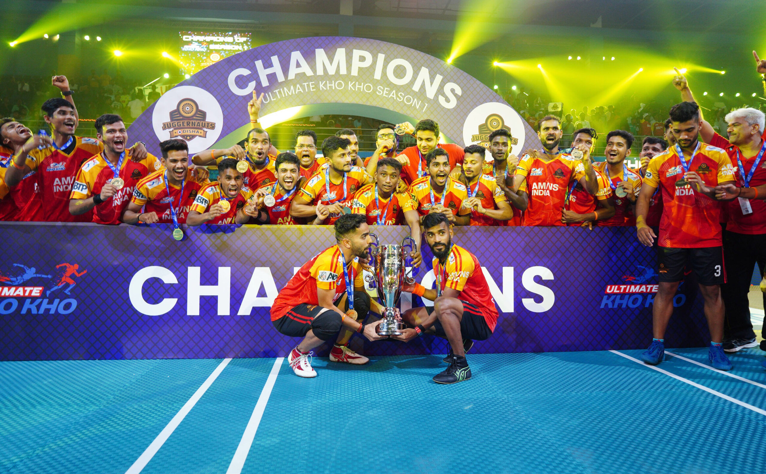 Odisha Juggernauts players celebrate with the trophy of the Ultimate Kho Kho Season 1 in Pune on Sunday, September 4, 2022